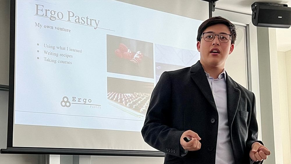 Eric Seo'25 presentin on his entrepreneurship experience of selling handcrafted bonbons as specialty gifts.