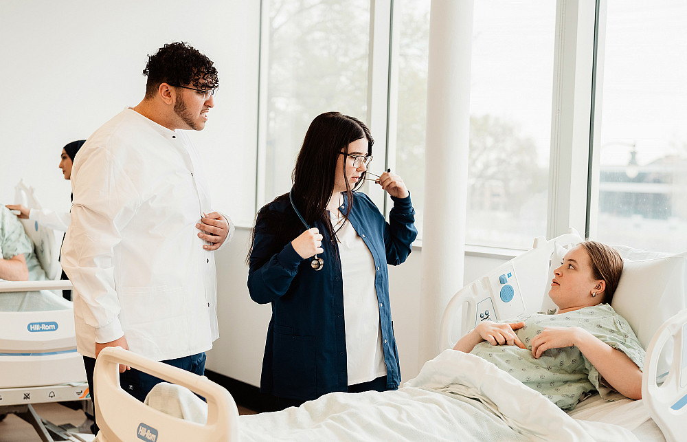 Beloit College students practice medical practices in the campus skills lab.