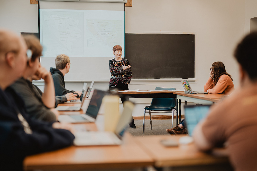 Professor Beth Dougherty leads a course in a classroom of Morse-Ingersoll Hall.