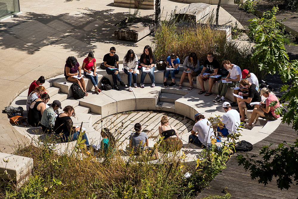 A class meets outdoors on the Beloit College campus.