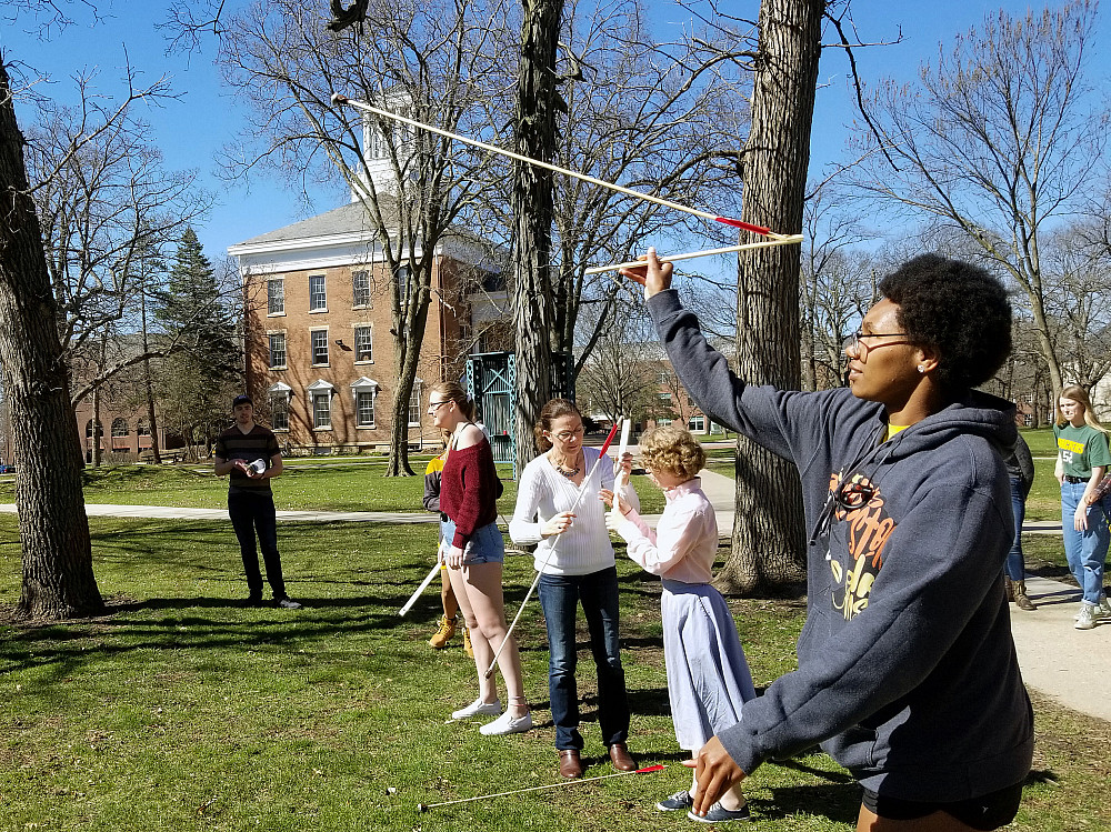 Beloit College students try spear throwing with atlatls in an Anthropology class.