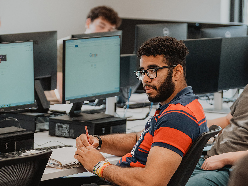 Beloit College students in a computer lab, turned to listen to the professor.
