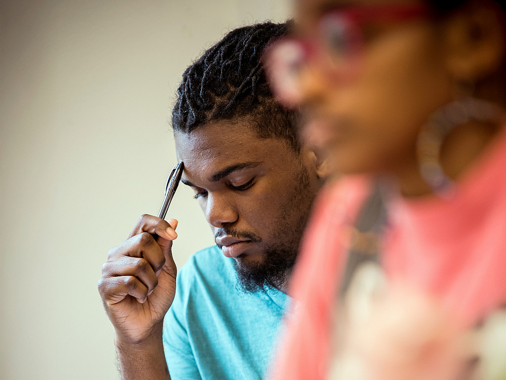 A Beloit College student thinks in the midst of class.