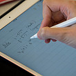 Student taking notes in a data analysis class.