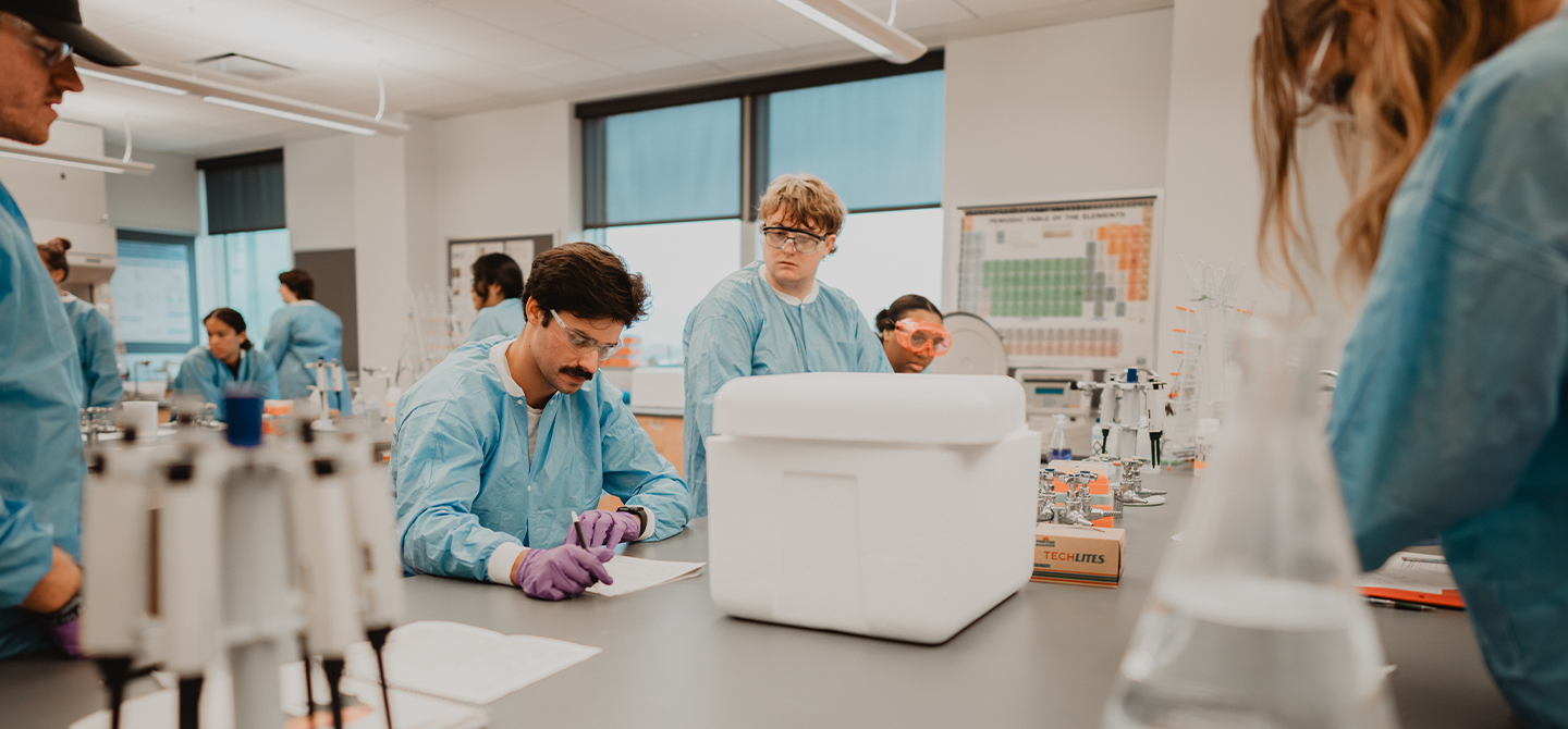 Biology students work on a lab project.