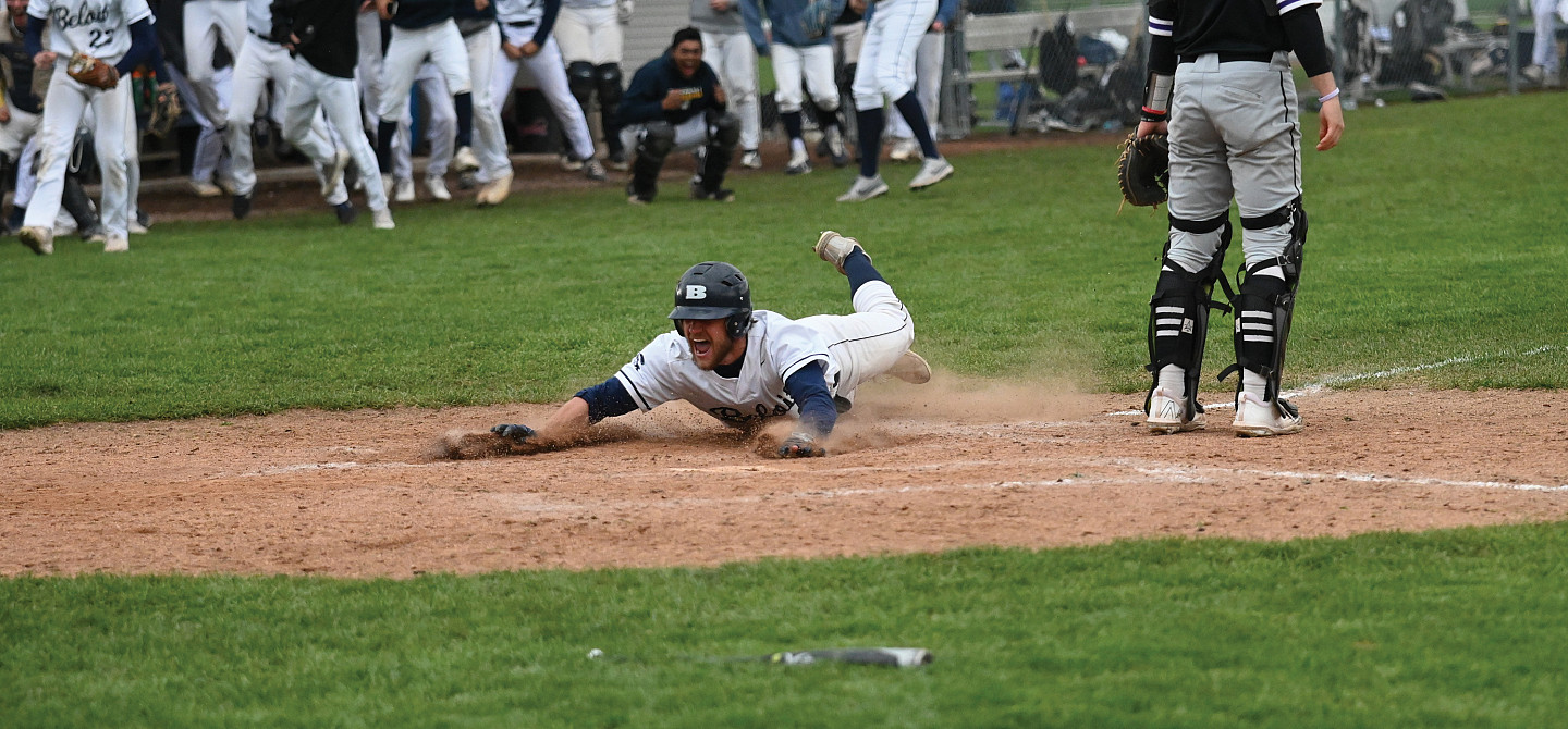 Garrison Ferone sliding onto home base.