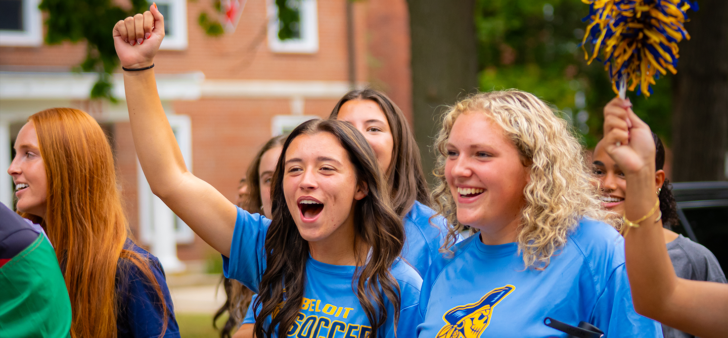 Students in Beloit College gear cheering.