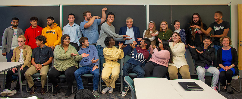 2023 Upton Scholar Joel Mokyr, hamming it up with students from the Economics senior seminar and Professor Laura Grube.