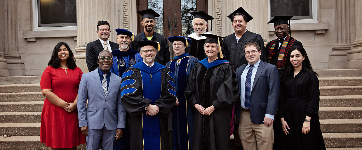 The inaugural platform party poses for a group photo with President Eric Boynton before the ceremony.