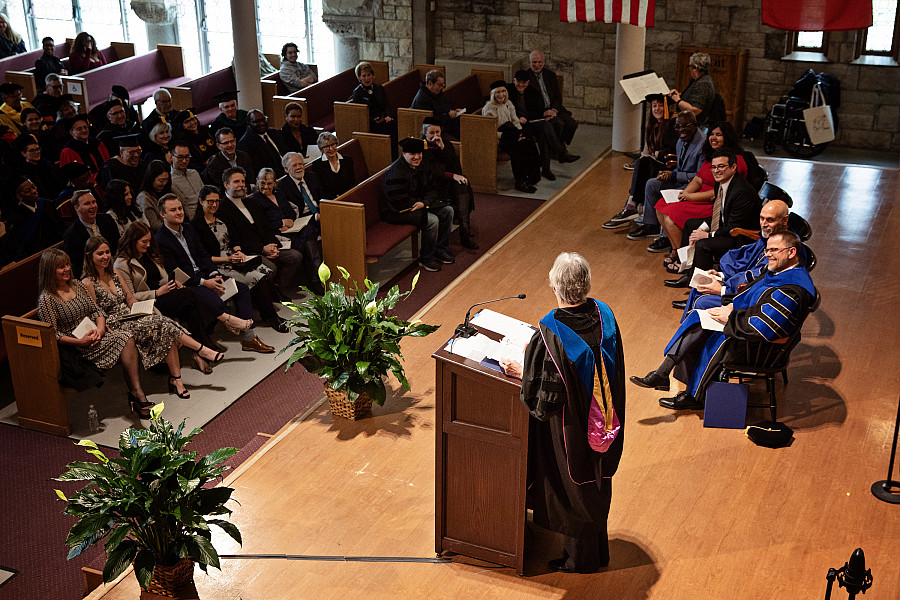 Provost and Dean of the College Donna Oliver delivers greetings to President Eric Boynton from the faculty.