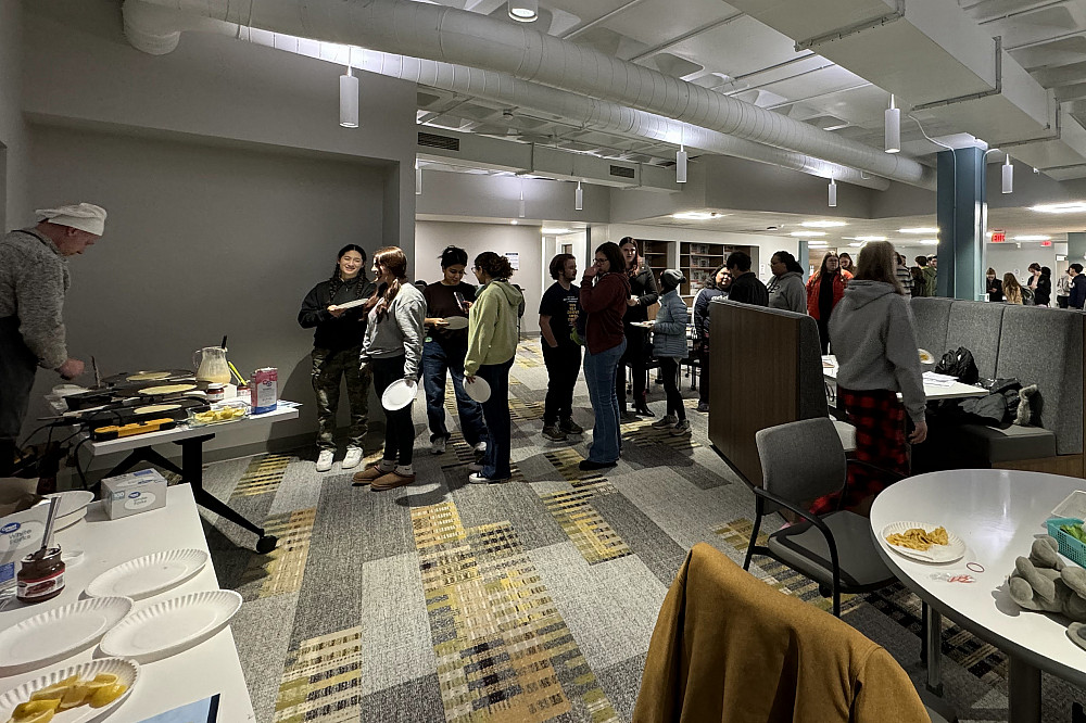 IMG 5098 Photo of a line of students waiting to be served crepes by Josh Moore.