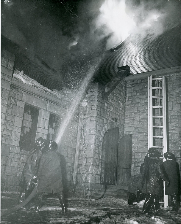 Firefighters work to put out the fire in Eaton Chapel