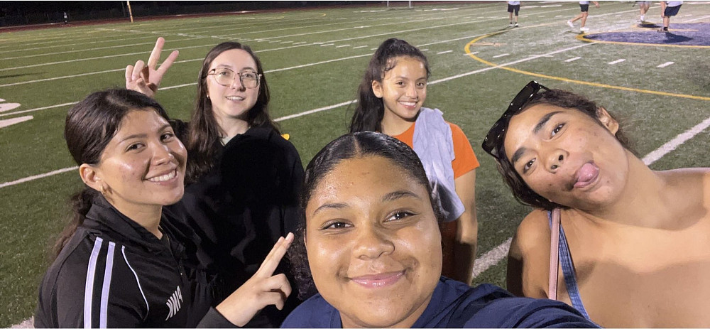 Kaylee Witte'26, center, made lasting friendships in her education and media studies majors, as well as with teammates. 