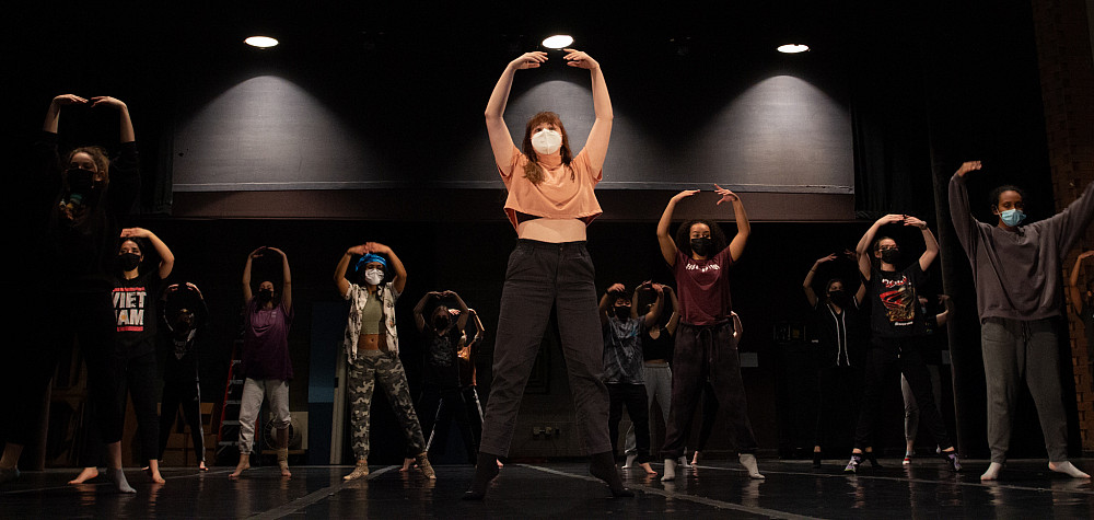 Kelli Badgley warms up with members of the cast of Chelonia. 