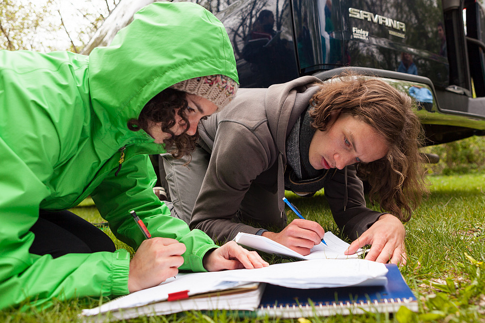 Beloit students record notes and data from a day of field study in their hydrogeology class.