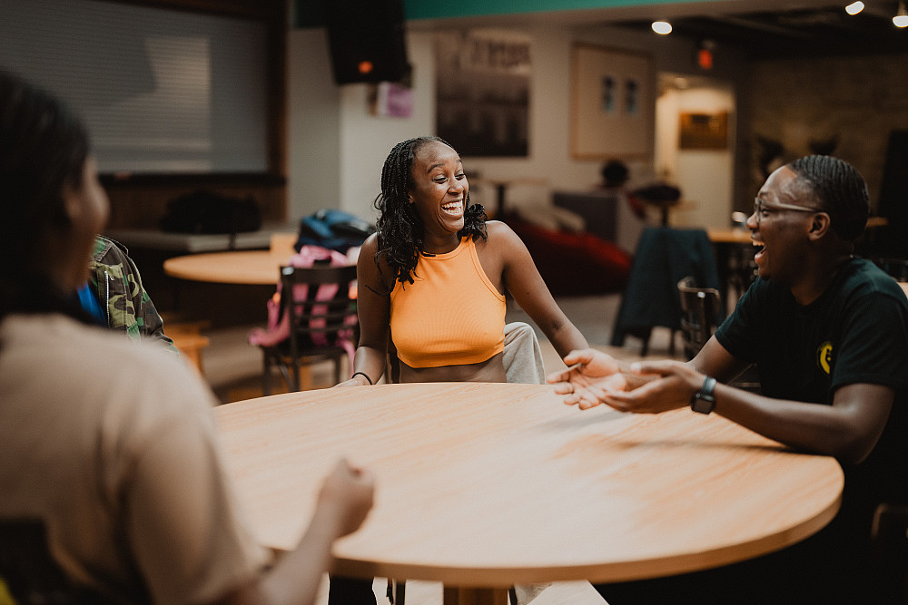 Students laughing inside of Grace's Place.