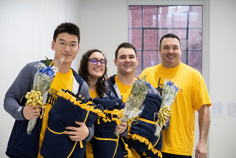 Beloit swim coach Kevin Schober and crew make sure plenty of congratulatory swag and flowers are ready for the inaugural swim meet at the...