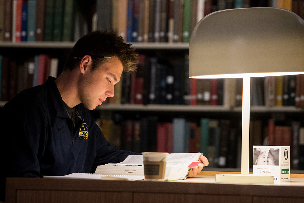 A Beloit student studies some of the many research publications and books available in the Morse Library.
