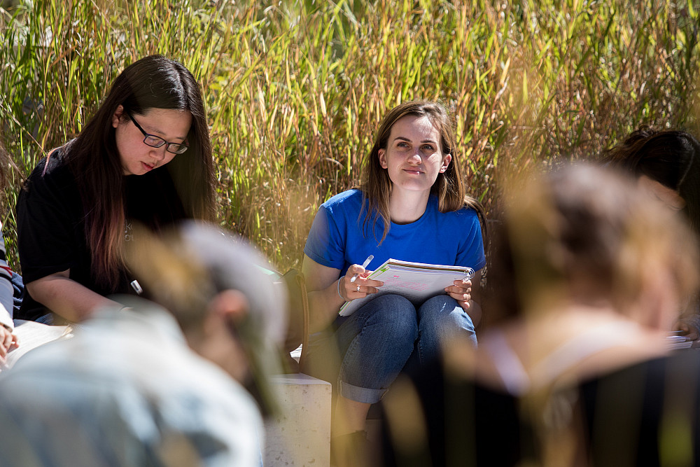 In spring and fall students attend a class outdoors in the garden near the Sanger Center for the Sciences.