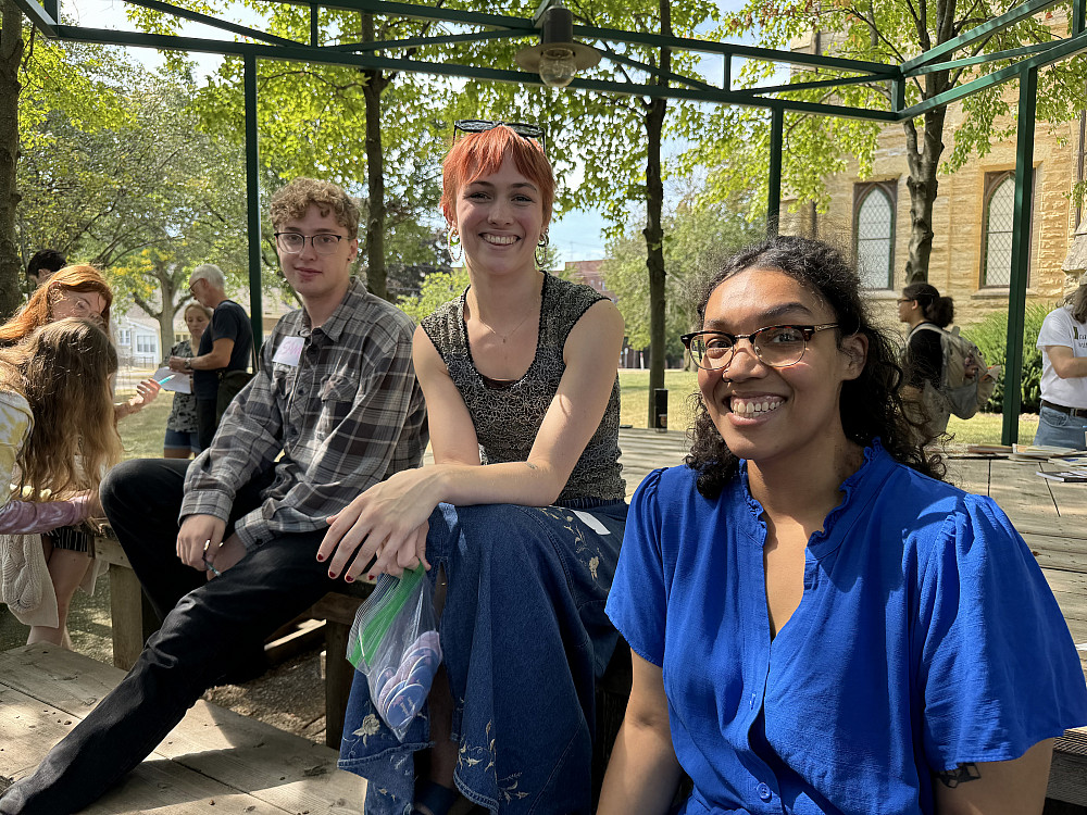 Sam Doherty'25, India David'25, and WAC coordinator Hannah Flores pose in the Poetry Garden