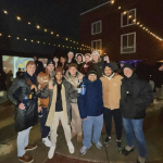 Matt Laszlo, David Rhoades, and students in the Marketing Practicum class gathered at the Wall to celebrate Last Call.