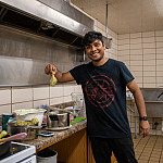 Abhishek Shekhar'24 helps out in the 609 kitchen on symposium day