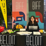 My Le’25 poses while tabling for the Beloit International Film Festival (BIFF) as an Impact Beloit Community Fellow.
