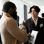 A student and alumni talk together at the 2024 Business Networking Summit.
