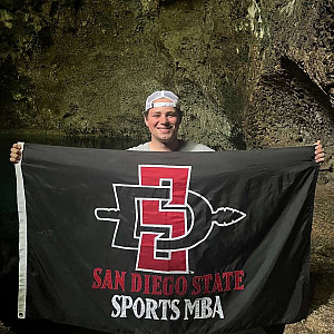 Thomas Kosakowski’23 representing his MBA program on a cave expedition in the Domincan Republic.