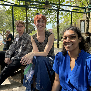 Sam Doherty’25, India David’25, and WAC coordinator Hannah Flores pose in the Poetry Garden