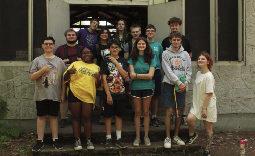 People smile and pose for a picture.