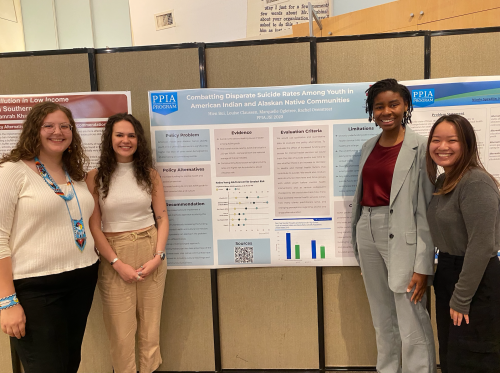 Louise and her project collaborators before their poster presentation. 