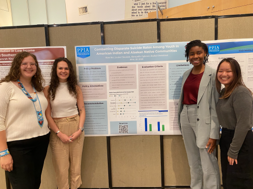 Louise and her project collaborators before their poster presentation.