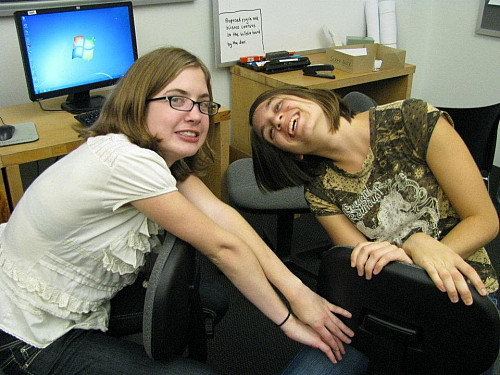 Marlena Fraune'13 at work and play with a classmate in the psych lounge