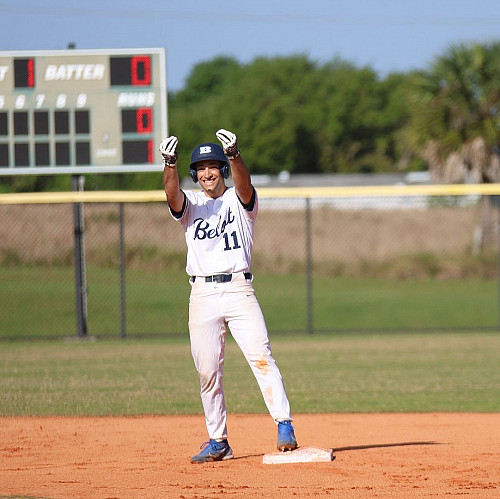 Jacopo Tamburini stands on second base celebrating.