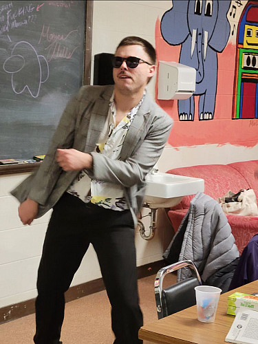 Cyrus Roman'24 goofing around in his costume at rehearsal.