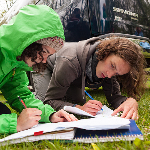 Beloit students record notes and data from a day of field study in their hydrogeology class.