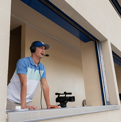 JT calls a game from the press box.