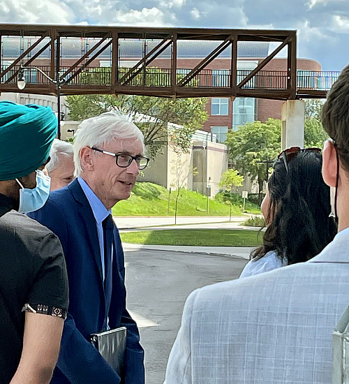 Governor Tony Evers greets students during an event honoring the energy efficiency of the Powerho...
