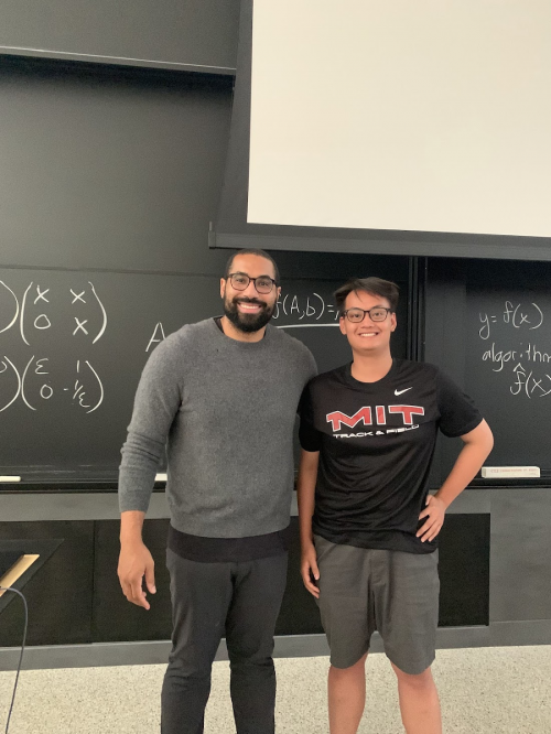 Vu Anh Le'25 poses with Dr. Jon Urschel, a professor of mathematics at MIT.