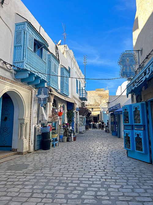 Farah's view of a beautiful blue street in Tunesia.