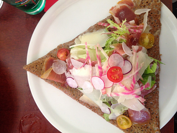 My favorite galette: prosciutto and melted camembert with a fresh vegetable salad on top.