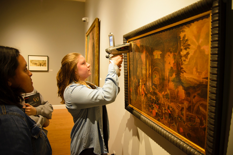 Chemistry major Sarah Farr'19 analyzes the painting Venus at the Forge of Vulcan with a handheld X-ray fluorescence spectrometer in the W...