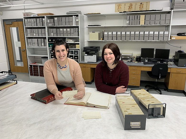 Helen Werner (left) and Haley Michael '19 (right) review museum records for their NAGPRA work at the Logan Museum.