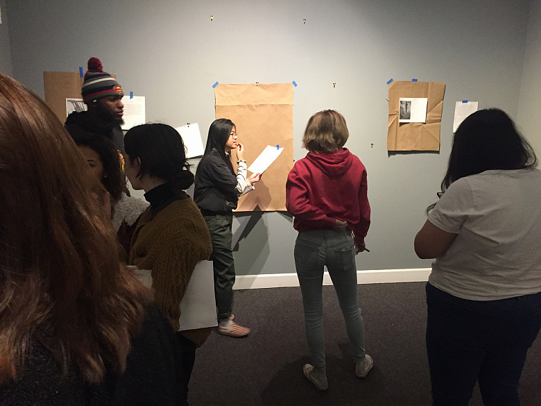 Students in the critical identity studies course Black Lives Matter work on the Wright Museum of Art.