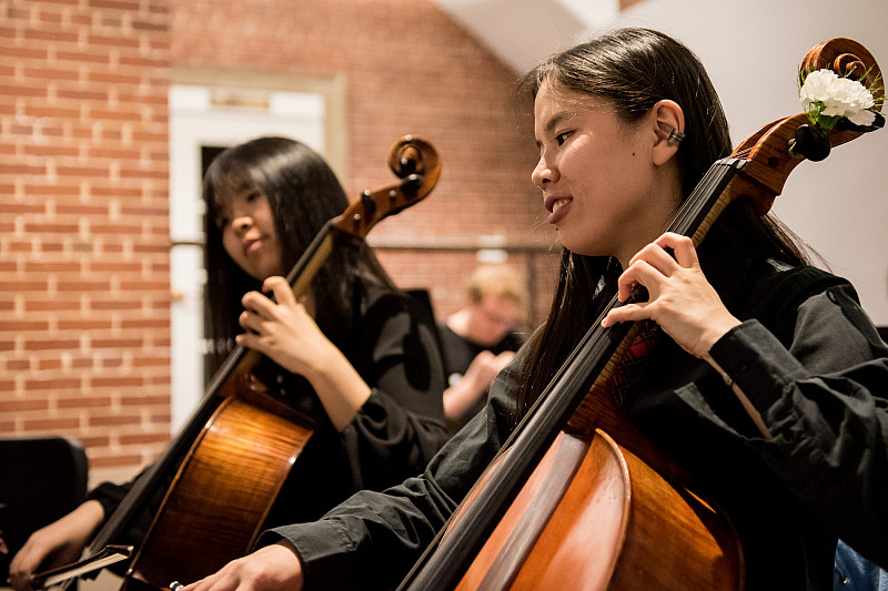 Student musical performance in the Wright Courtyard Gallery.