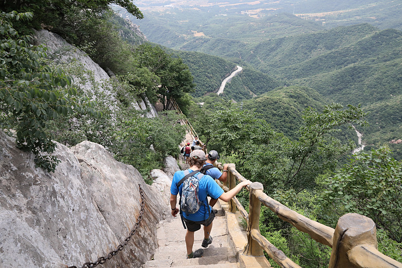 Beloit professors and students climb down a steep trail along the Yellow River in China during th...