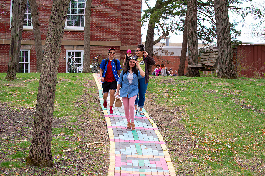 Students walk along the “Rainbow Path near the Wright Museum of Art.