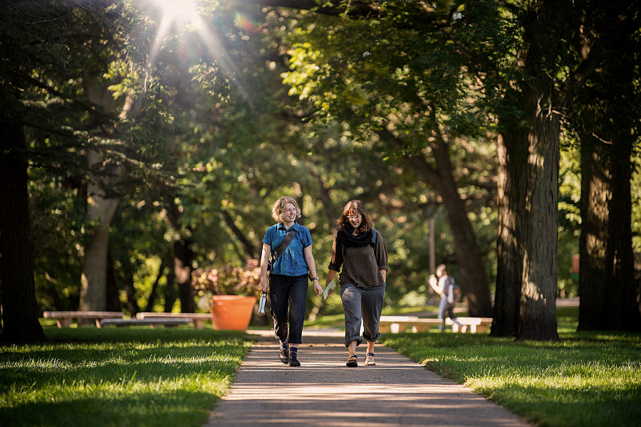 Beloit College students walk down one of the park-like walkways in the Beloit College campus.