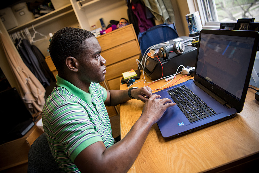 A Beloit student finds time to study in his dorm room.